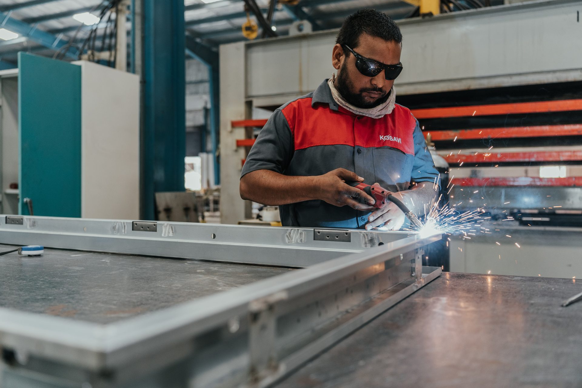 Kosavi factory interior — steel fabrication workstation